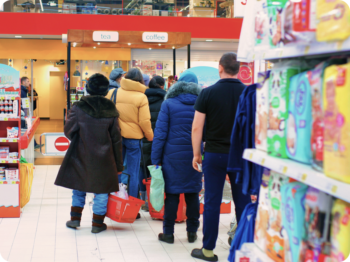 People waiting in a queue at a supermarket